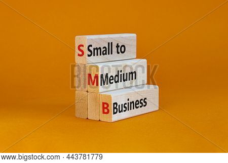 Smb Small To Medium Business Symbol. Words Smb Small To Medium Business On Blocks On A Beautiful Ora