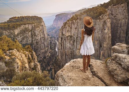 Tourist Woman On The Edge Of A Cliff Of Tazi Canyon In Manavgat, Antalya, Turkey. Greyhound Canyon, 