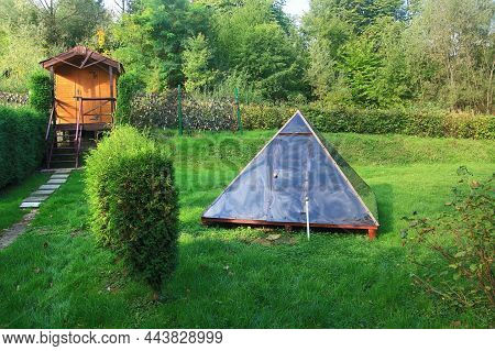 The Photo Shows A Pyramid Used In Folk Medicine To Treat Health Abnormalities. The Pyramid Is Locate