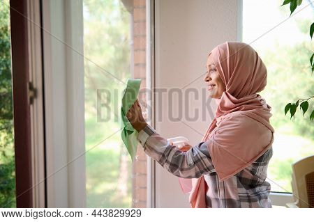 Waist-length Side Portrait Of A Cheerful Happy Gorgeous Young Arab Muslim Woman With Covered Head In