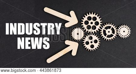 Industrial Concept. On The Black Surface, Arrows, Gears And An Inscription - Industry News