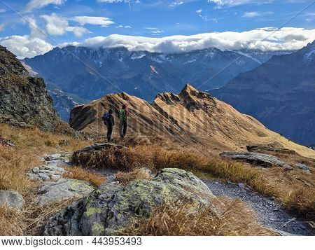 Friendship. Hiking With Friends In A Beautiful Mountain Landscape Above Glarus .autumn Hike. Discove