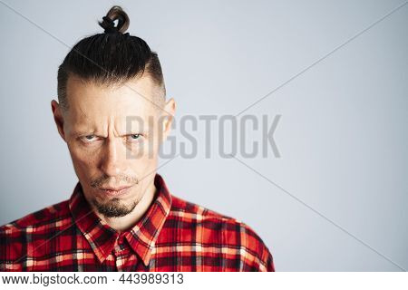A Close-up Photo Of A Strictly Ruthless Seriously Young Man