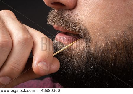 Close Up Bearded Man Clean Teeth From Food Stuck Her Teeth With Toothpick After Breakfast, Lunch, Di