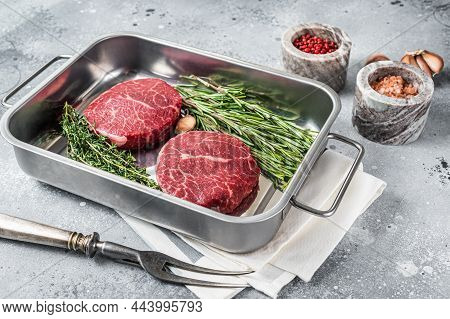 Raw Fillet Mignon Beef Steaks From Tenderloin. Gray Background. Top View