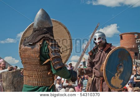 Medieval Fight At A Historical Reenactment Festival Held In Abalak, Siberia. Russia