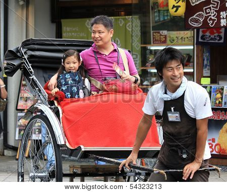 A Traditionaljapanese Rickshaw In Arashiyama District