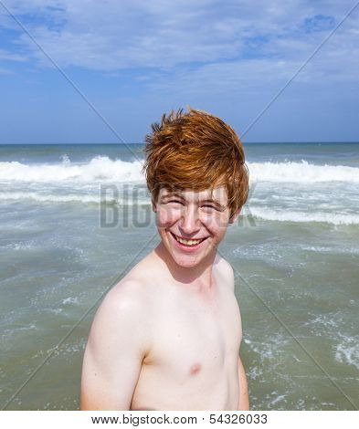 Boy Enjoys The Waves Of The Sea