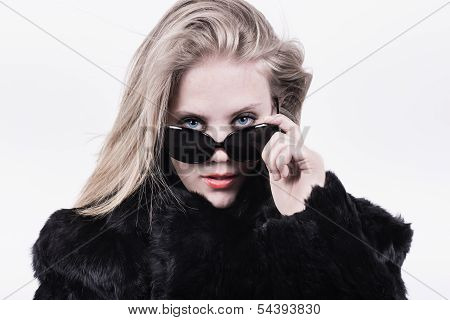 Snobbish Upper Class Girl In Dark Sunglasses And Fur