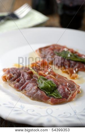 Saltimbocca alla Romana on a rustic table