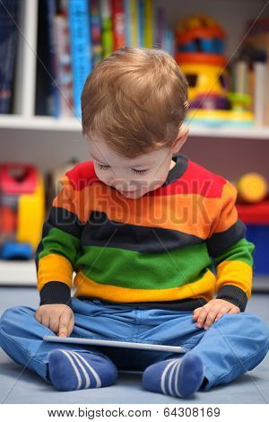 Happy 2 Years Old Boy Using A Digital Tablet Computer