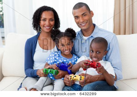 Smiling Afro-american Family Playing Video Games