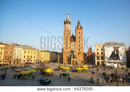 KRAKOW, POLAND - FEB 26, 2014: View of the Main Square. It dates to the 13th century, and at roughly 40,000 m it is the largest medieval town square in Europe.