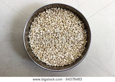 closeup of dry white split lentil also called as urad dal in India