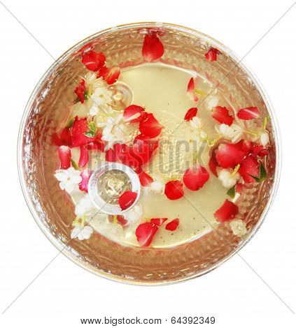 Water with rose petal and jasmine in silver bowl in Thai style