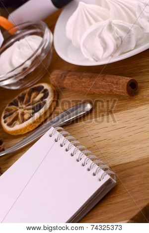 Meringue, Lemon And Cinnamon On Wooden Backgroubd