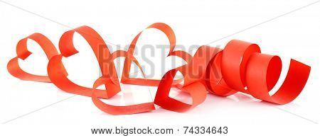 Heart shaped red paper ribbon isolated on white