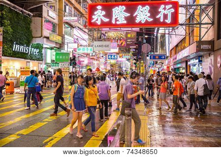 HONG KONG , CHINA - AUG 13 : Mongkok at night on August 13, 2014 in Hong Kong, China. Mongkok in Kowloon is one of the most neon-lighted place in the world and is full of ads of different companies.