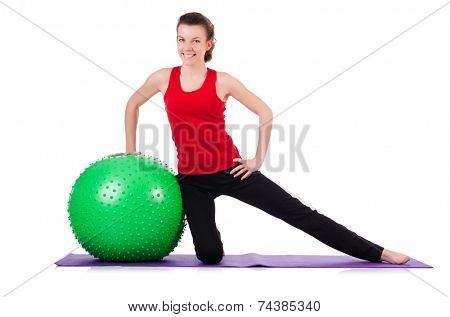Young woman exercising with swiss ball
