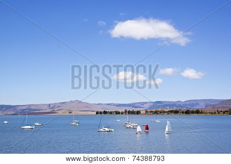 View Of Yachts In Dam And Cloudy Blue Sky