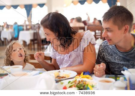 young caucasian family having dinner together.