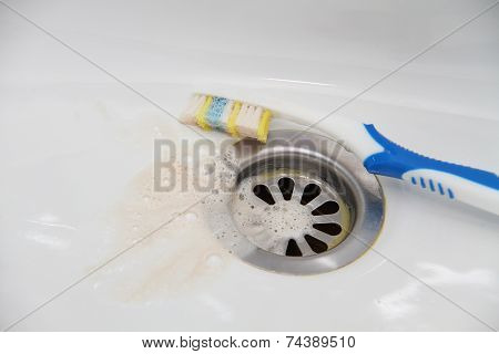 Blood and toothpaste on the toothbrush