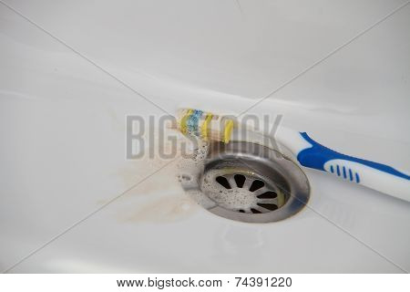 Blood and toothpaste on the toothbrush