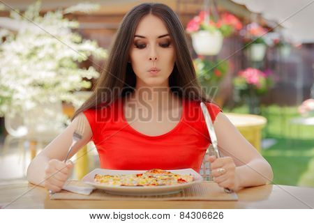 Young Woman Thinking About Eating Pizza on a Diet