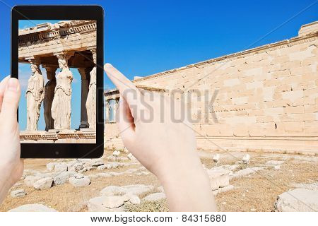 Tourist Taking Photo Of Caryatids At Acropolis