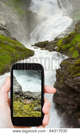 Tourist Taking Photo Of Kjosfossen Waterfall