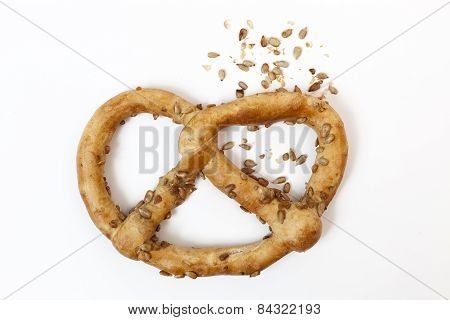 Bavarian Pretzel With Sunflowers Seeds Isolated On White Baskground