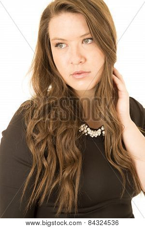 Beautiful Brunette Wearing A Black Dress Soemly Staring