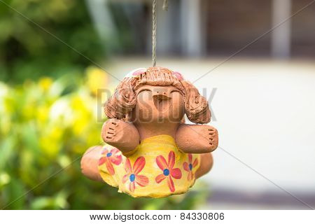 smile baked clay dolls in the garden