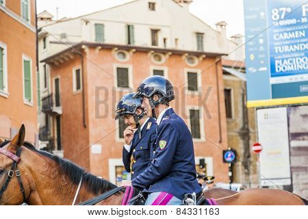 Police On Horses Are Watching And Helping The Spectators At The Arena Di Verona