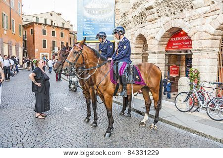 Police On Horses Are Watching And Helping The Spectators At The Arena Di Verona