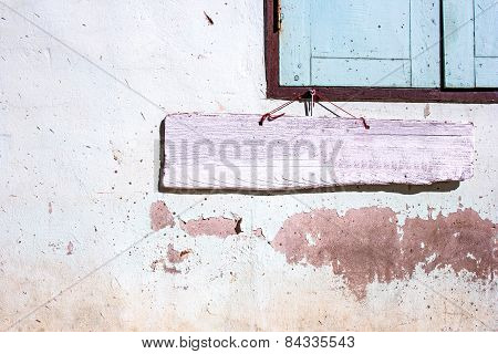 Pink Wooden Sigh On Old Cement Wall