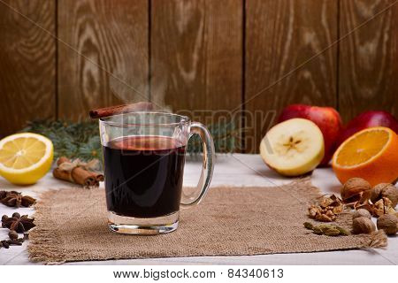 Mulled Wine, Punch And Spices For Glintwine On Wooden Background