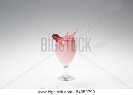 Splash Of Milk Strawbery In A Glass