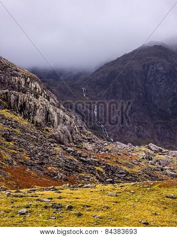 Waterfall Streams Down A Mountain In Snowdonia