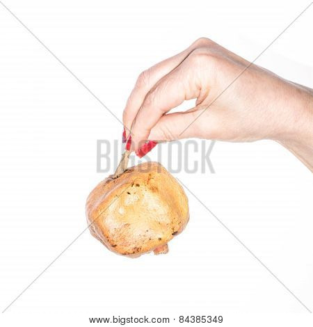 Hand with pomegranate isolated on white background