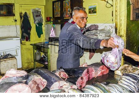 Man Sells Fresh Fish In His Shop