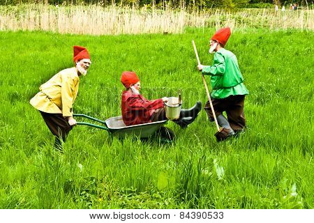 Three Garden Gnomes Enjoy Children At The Festival For Inauguration The New Quellenpark