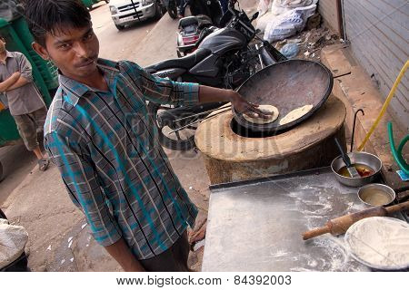Delhi, India - November 5: Unidentified Man Makes Chapati At Streetside Restaurant On November 5, 20