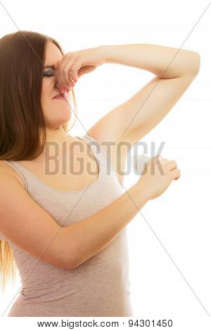 Girl Applying Stick Deodorant In Armpit.