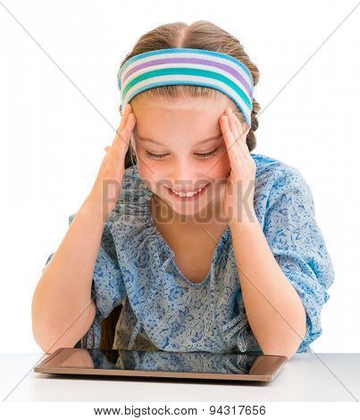 Happy little girl and her magic tablet