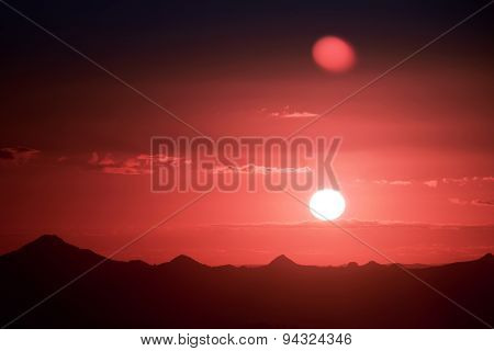 Sunset silhouette over the mountain