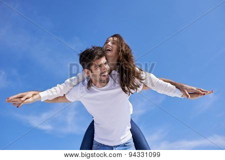 happy young romantic couple have fun relax smile at modern home outdoor terace balcony terace