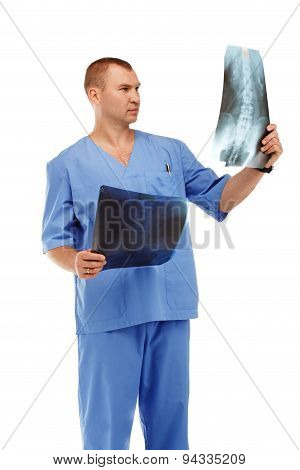 Portrait Of A Young Male Doctor In A Medical Surgical Blue Uniform Against A White Background