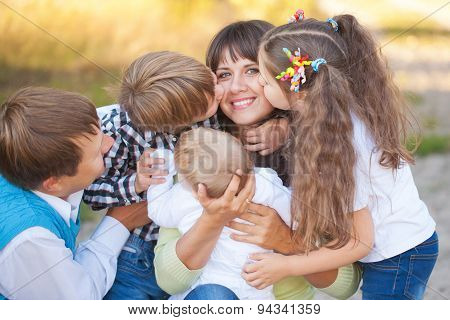 Large Family Hugging And Having Fun