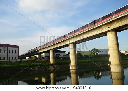 Singapore Mass Rapid Train (mrt) Travels On The Track